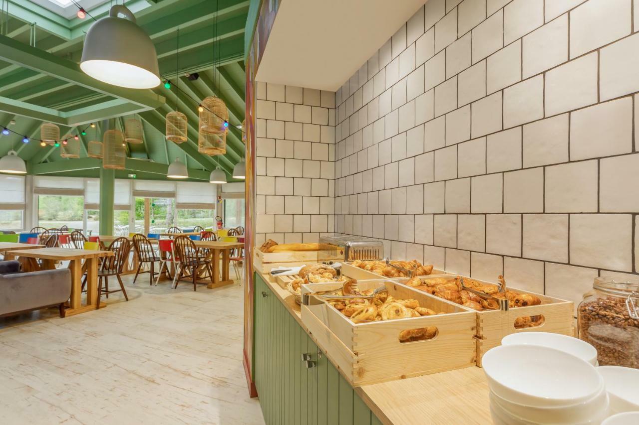 ホテル Center Parcs Les Bois Francs ヴェルヌイユ・ダヴル・エ・ディトン エクステリア 写真